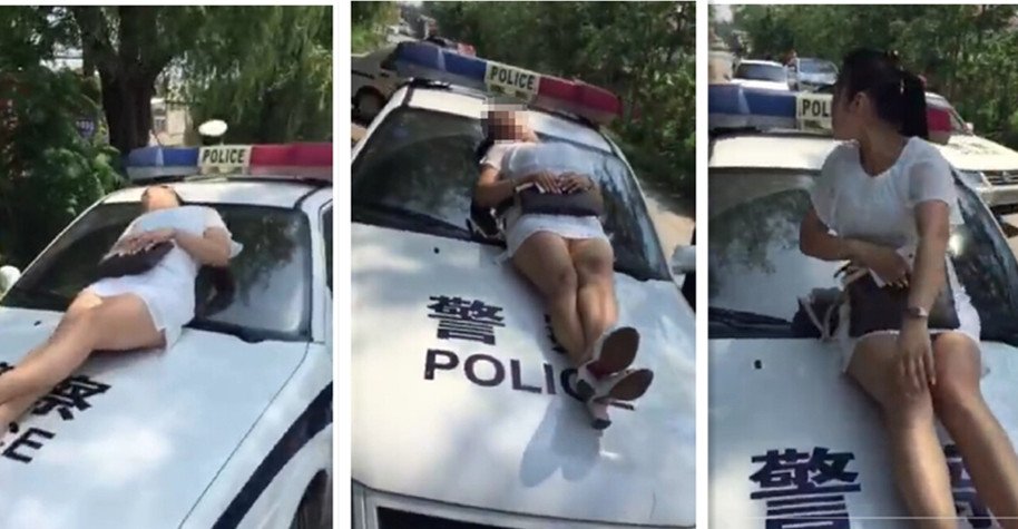 丈夫酒驾被查 怀孕妻子躺警车上阻挠执法(图)