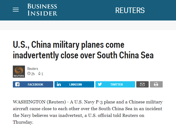 中美军机南海上空近距离相遇 国防部回应