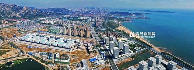 东方影都大剧院封顶 灵山湾珊瑚贝桥亮相